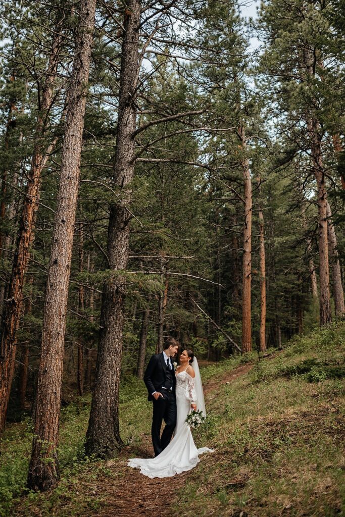 Bride and groom portraits in the forest during their destination wedding