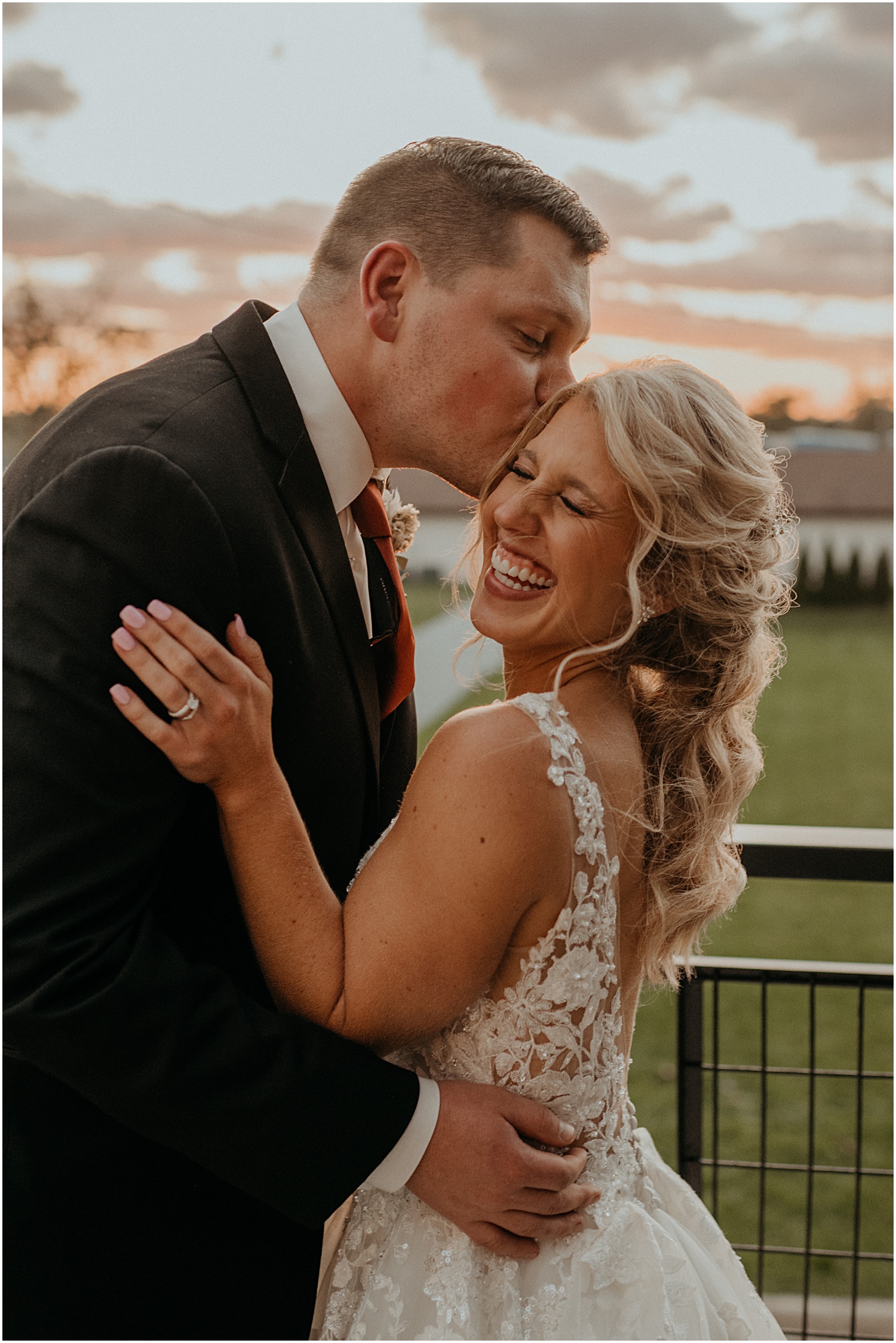 bride and groom portraits in michigan wedding venue during golden hour