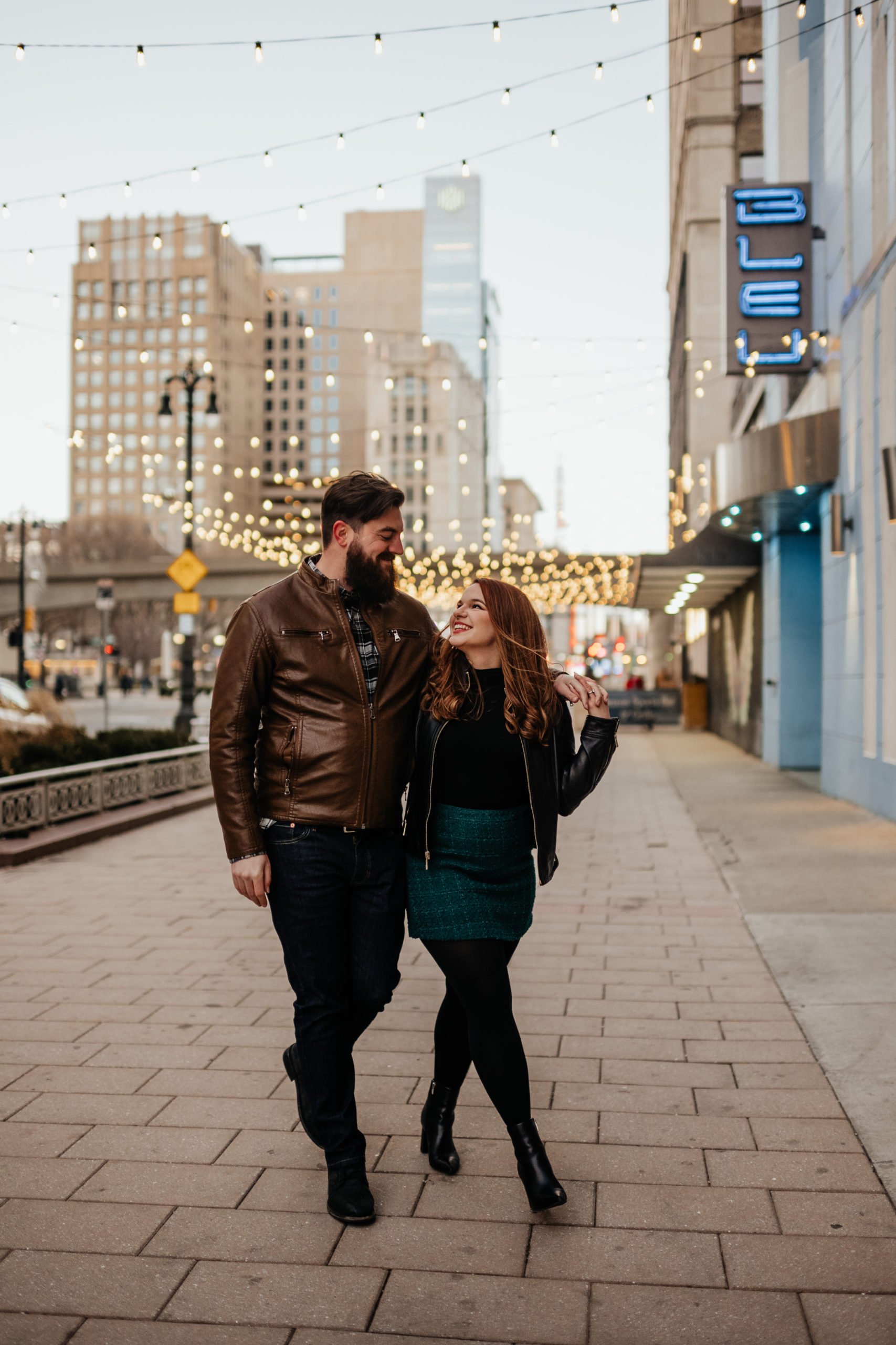 Couple walking down sidewalk in downtown Detroit, Michigan