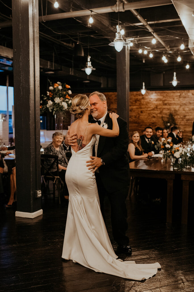 Bride and father dancing