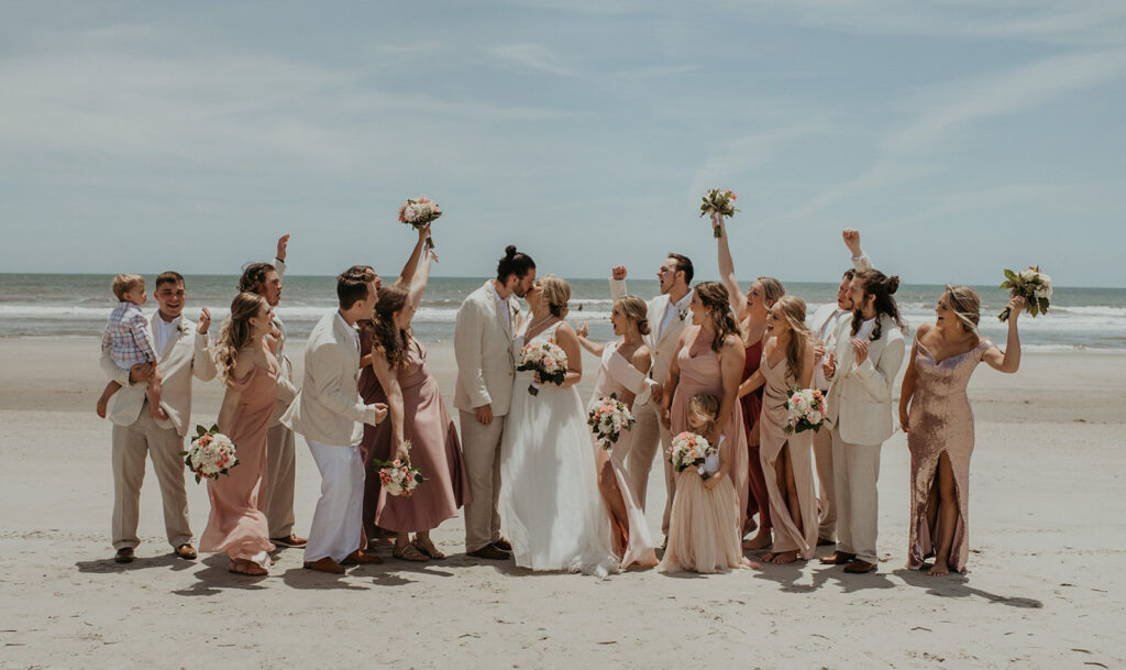 Bridal party photos on Folly Beach from elopement in  Charleston SC captured by Charleston elopement photographer Kim Kaye