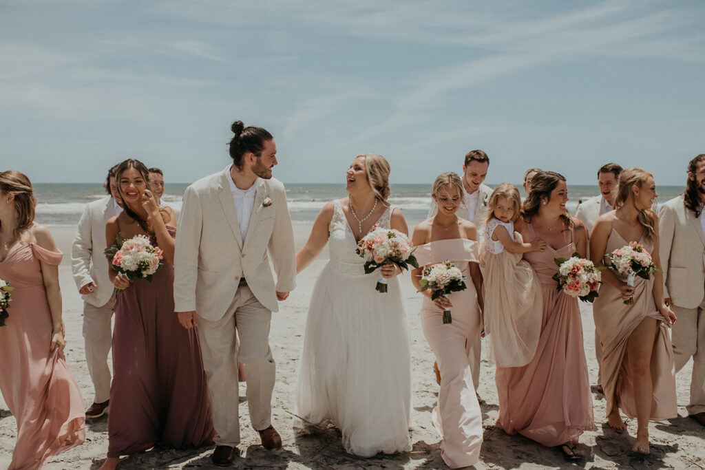 Bridal party photos on Folly Beach from elopement in  Charleston SC captured by Charleston elopement photographer Kim Kaye