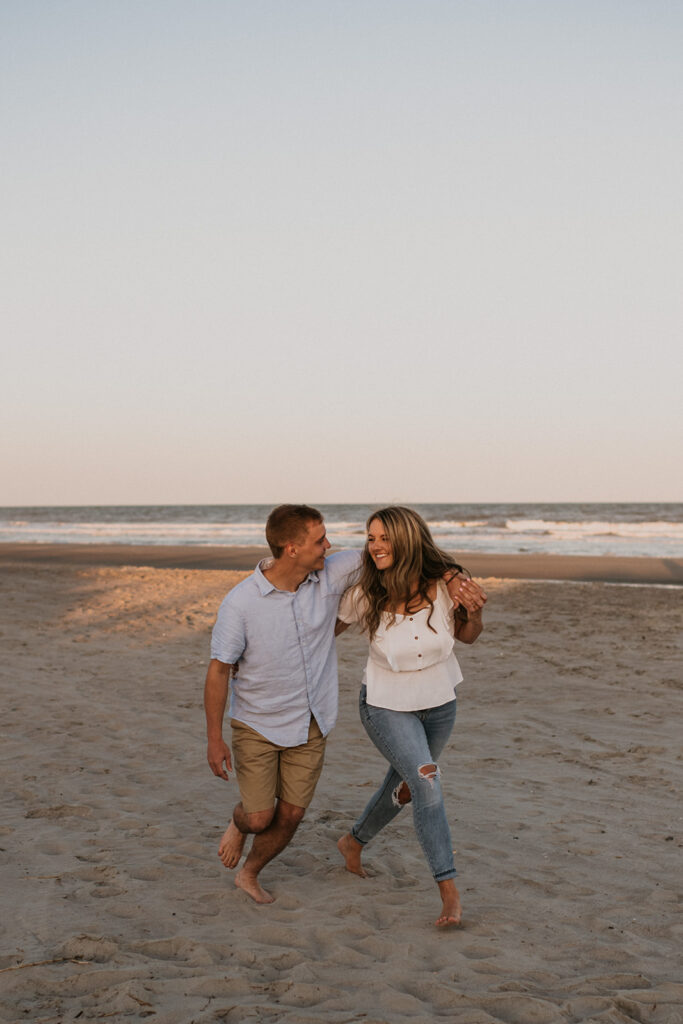 Couples sunset engagement photos on Folly Beach in SC captured by Charleston engagement photographer Kim Kaye