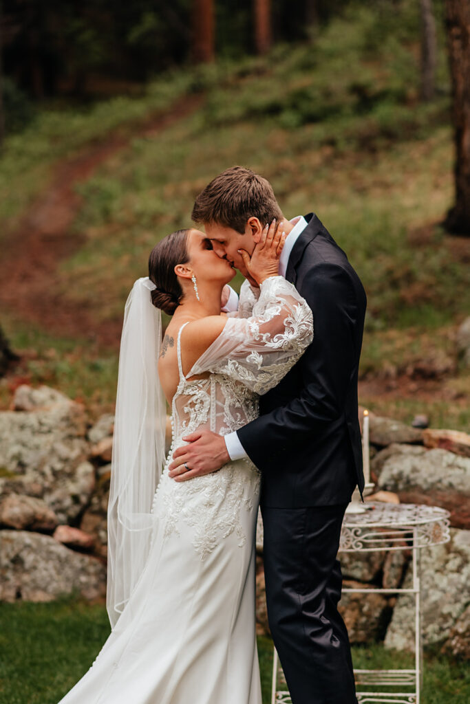 Bride and groom kissing during Estes Park elopement in Colorado