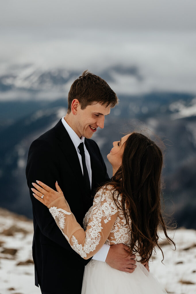 Couple posing for portraits from an Estes Park elopement in Colorado