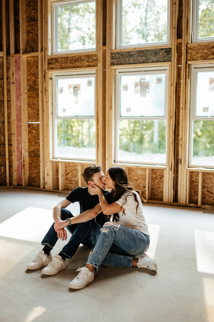 couple sitting inside future home