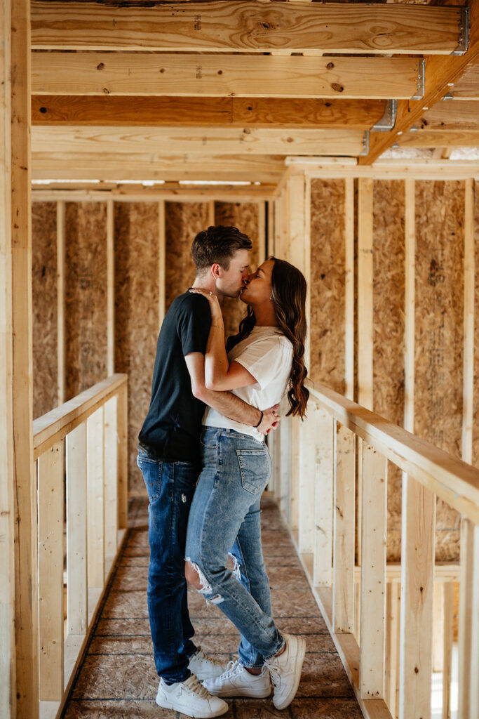 couple kissing in future home
