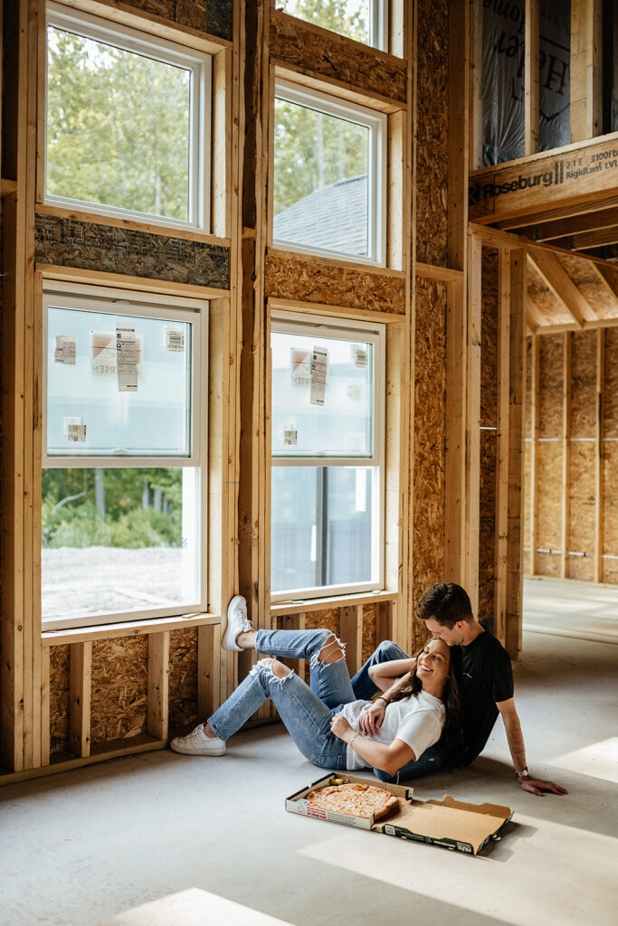 couple eating pizza in future home