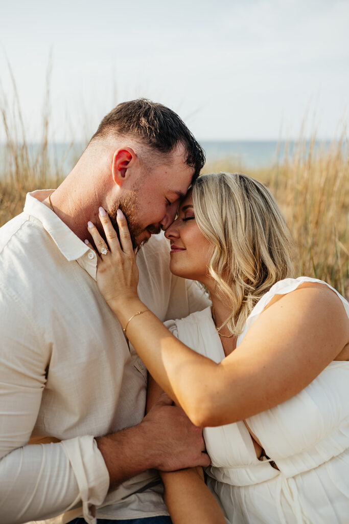couple posing for engagement pictures at Indiana dunes state park