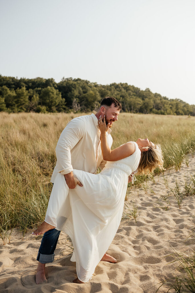 couple posing for engagement pictures in Indiana dunes state park