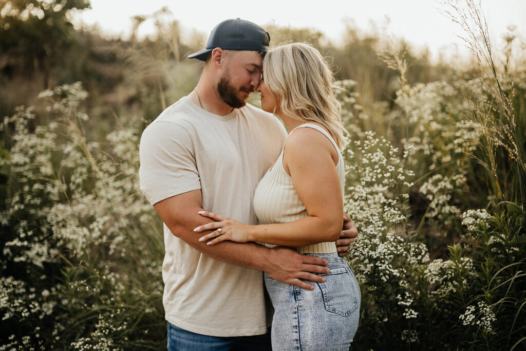 wildflowers engagement couple hugging