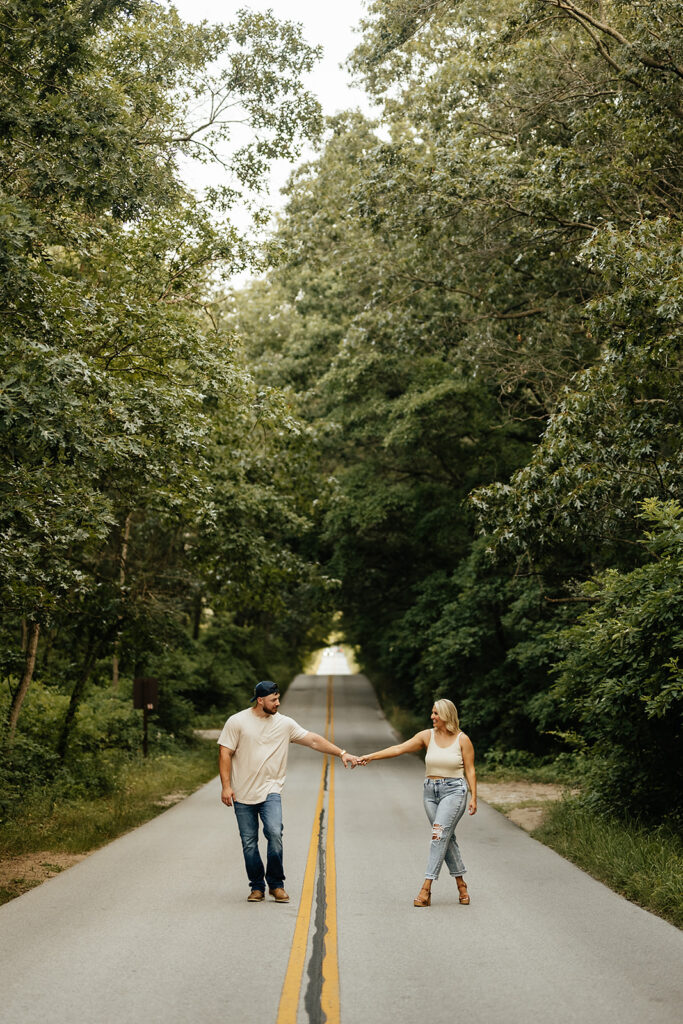 couple walking on the street in Indiana for engagement