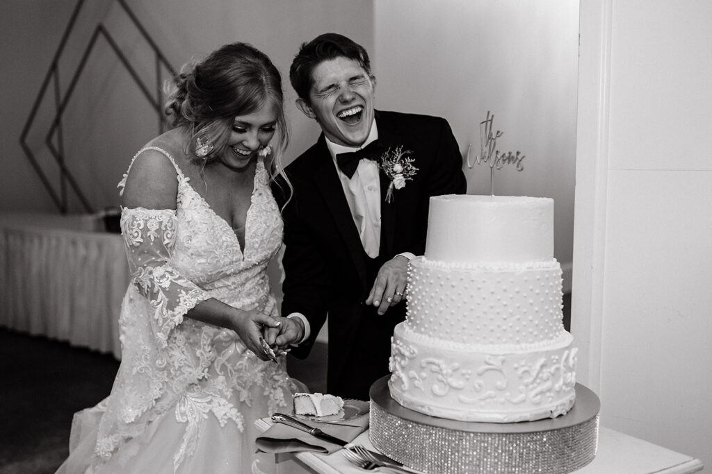 bride and groom summer wedding in Vincennes IN cake cutting