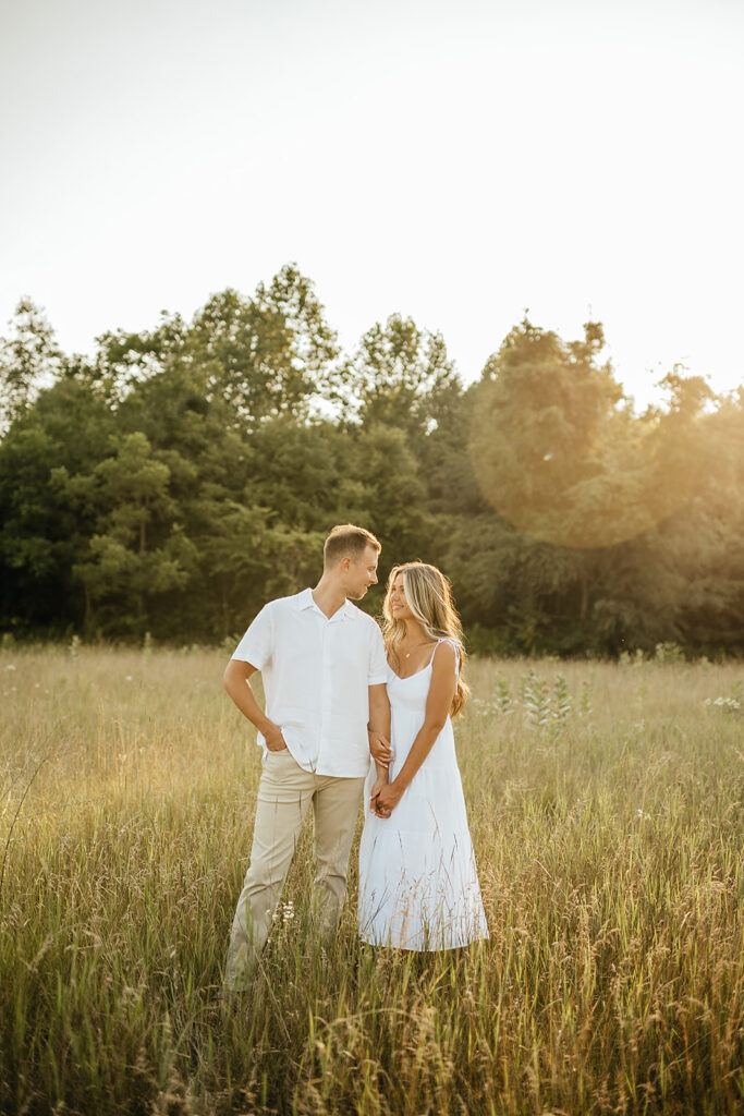 warm and romantic engagement photos couple holding hands