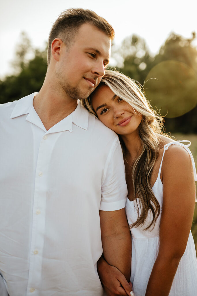 warm and romantic engagement photos couple holding hands