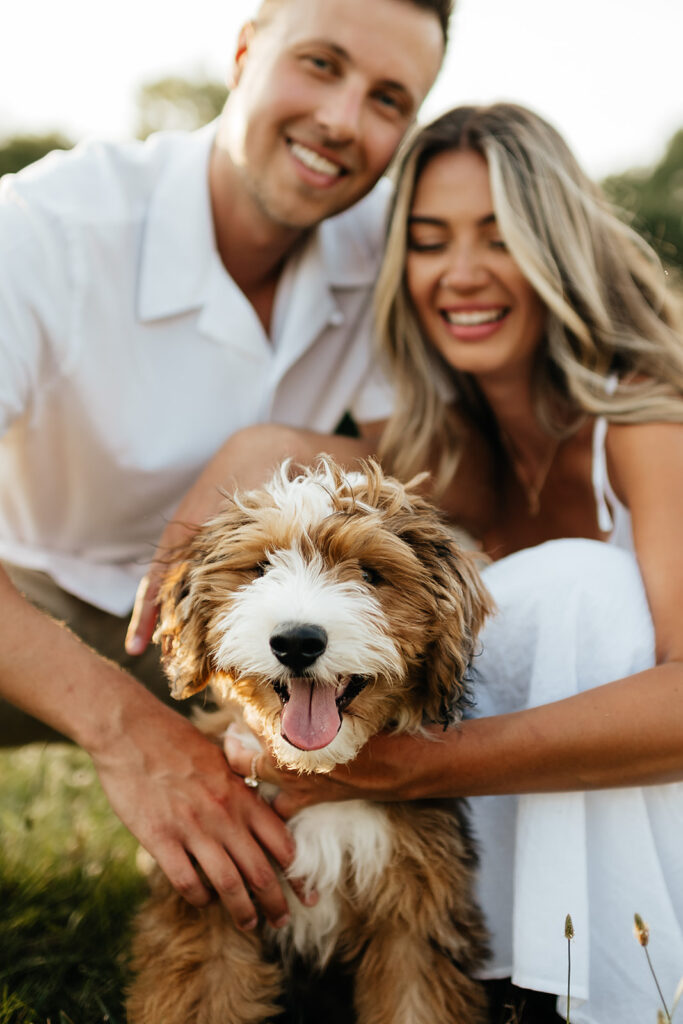 couple in Metea Park for engagement photos with their dog