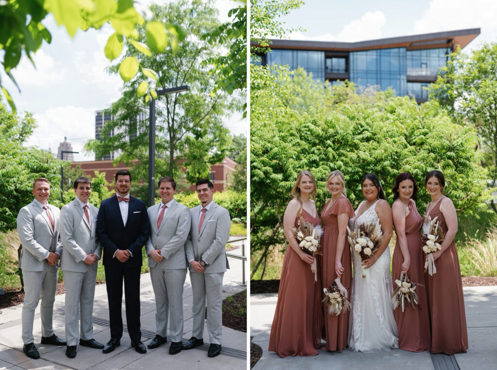 Groom in navy suit with groomsmen in gray suits and bride in white lace wedding dress with bridesmaids in terracotta dresses