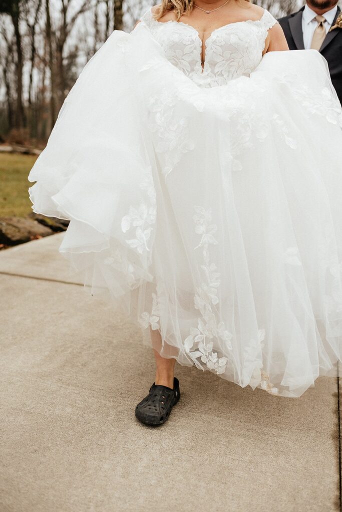 Micro wedding vs elopement: Unique ideas for a nontraditional wedding - Bride wears crocs with her wedding dress