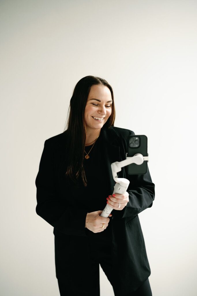 Wedding content creator holding an iPhone attached to a mount