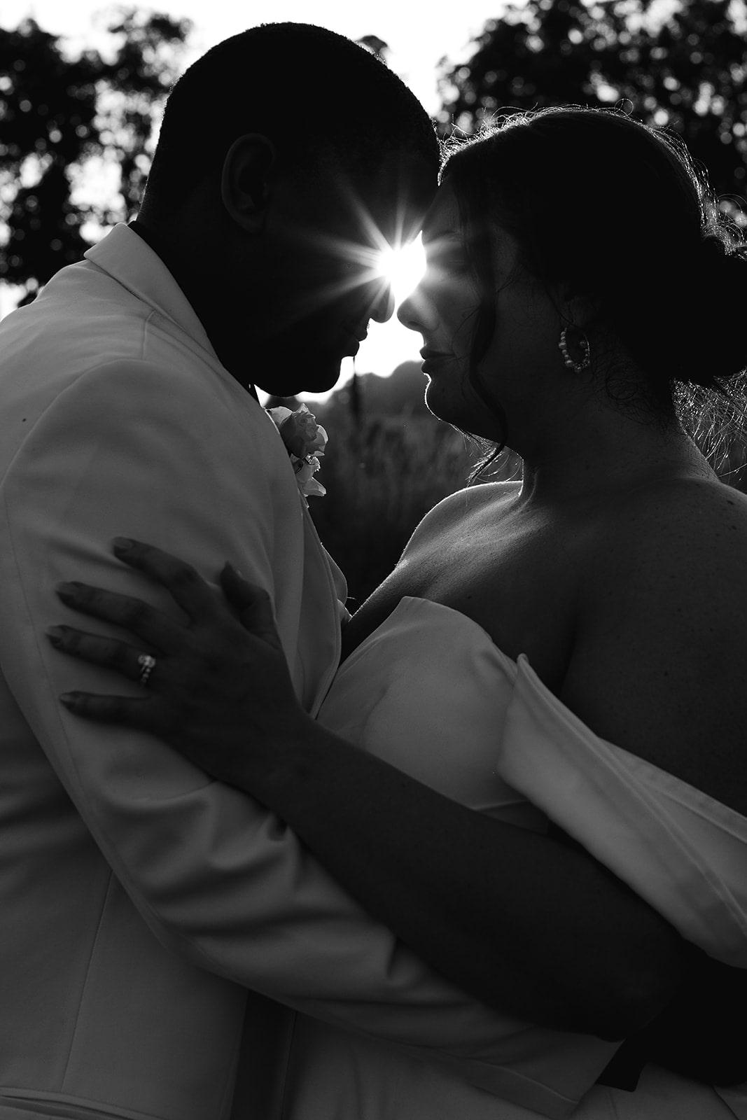 Bride and groom stand forehead to forehead during their sunset wedding photos at Union 12 