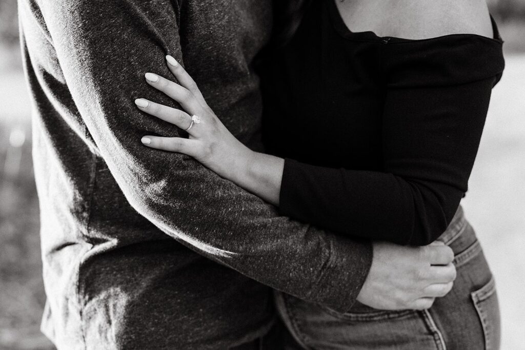 Couple hugs during their outdoor engagement session in Indianpolis