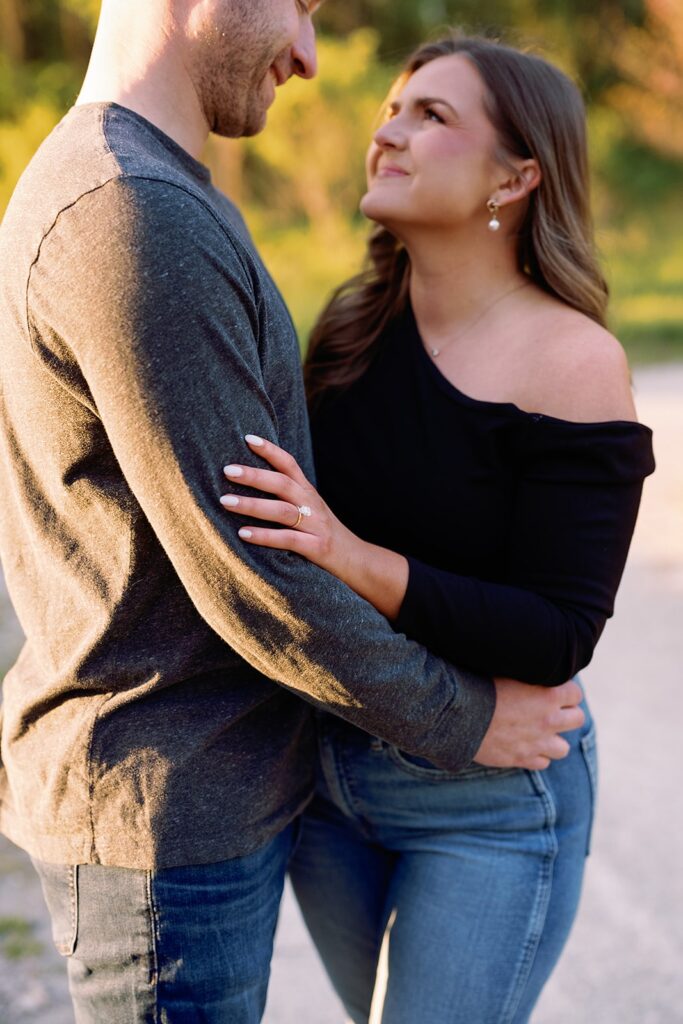 Couple hugs during their outdoor engagement session in Indianpolis