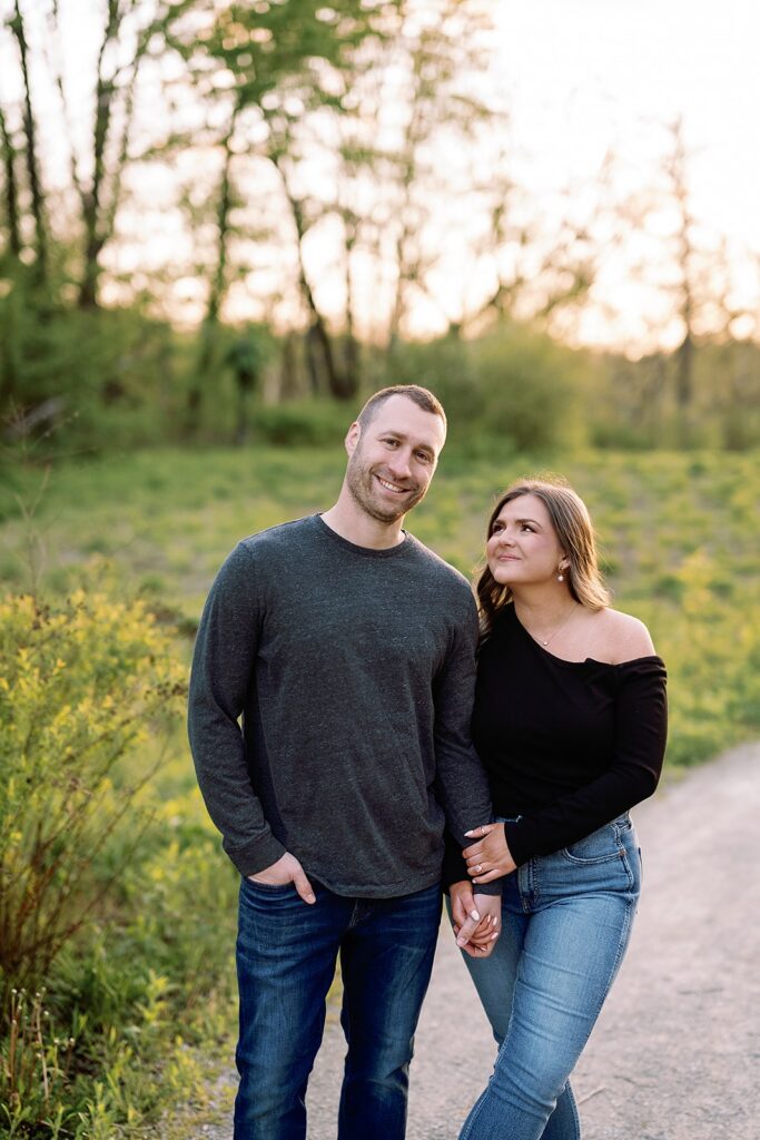 Couple holds hands during their Newfields engagement session in Indianpolis