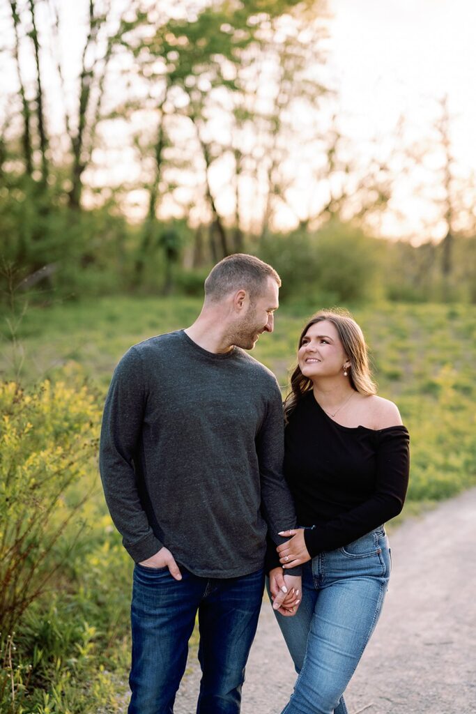 Couple holds hands during their Newfields engagement session in Indianpolis