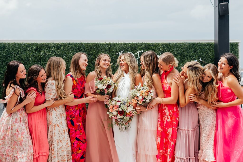 Bride and bridesmaids wearing non traditional wedding dresses 