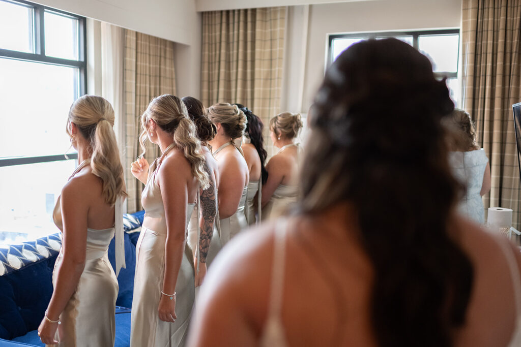 Bride and bridesmaids sharing a first look