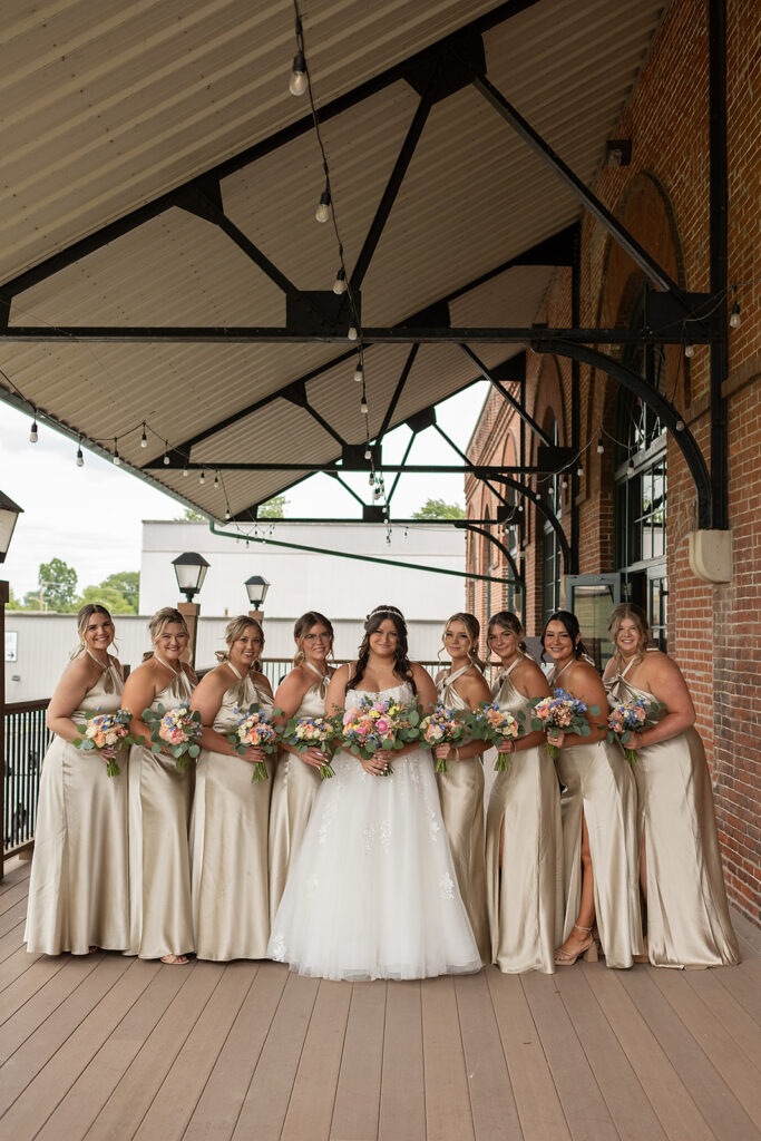 Outdoor bride and bridesmaids portraits from a downtown summer Fort Wayne wedding in Indiana