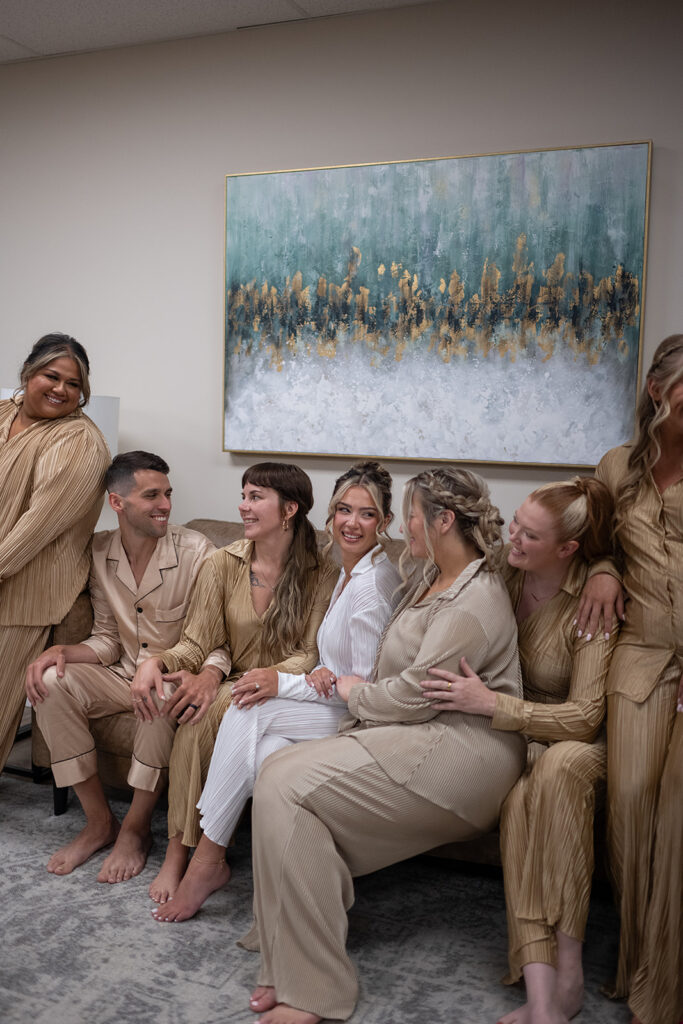 Bride and bridesmaids portraits in their pajamas in the bridal suite