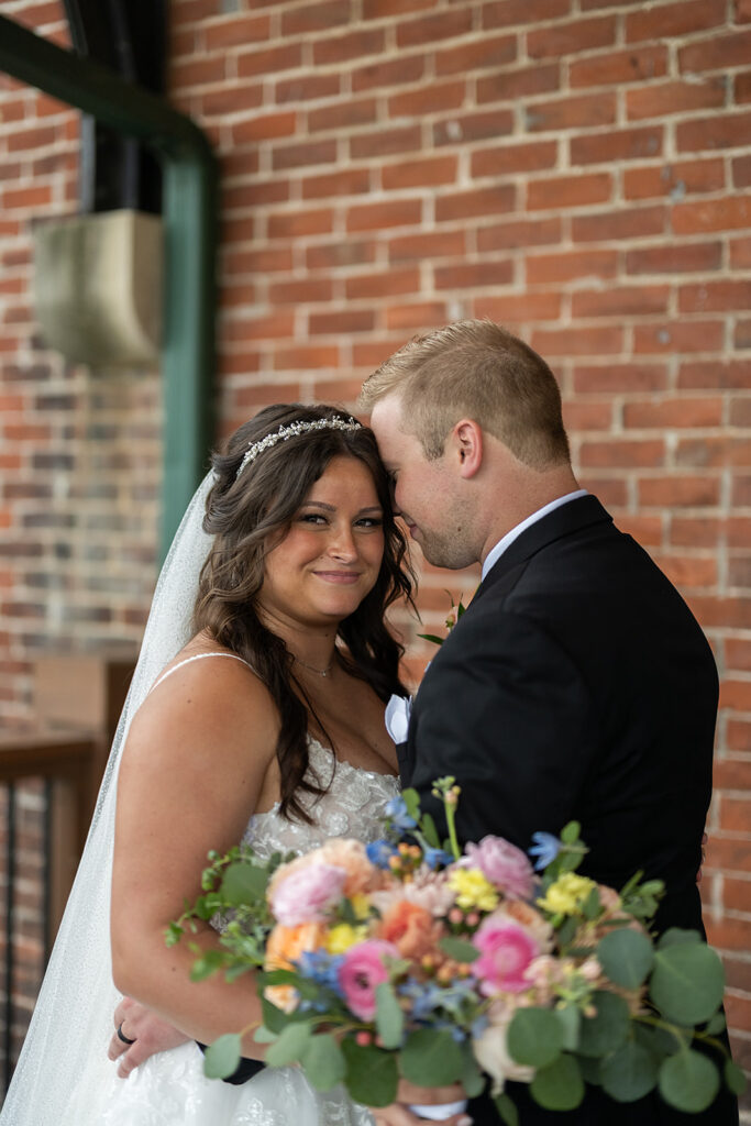 Outdoor bride and groom portraits from a downtown summer wedding in Fort Wayne, Indiana