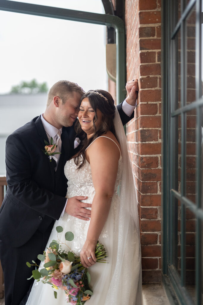 Outdoor bride and groom portraits from a downtown summer wedding in Fort Wayne, Indiana