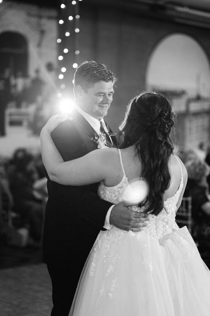 Black and white image of a bride sharing a first dance with her father