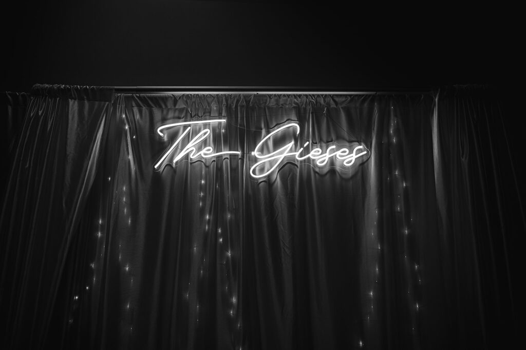 Black and white photo of a custom wedding reception sign that says the gieses 