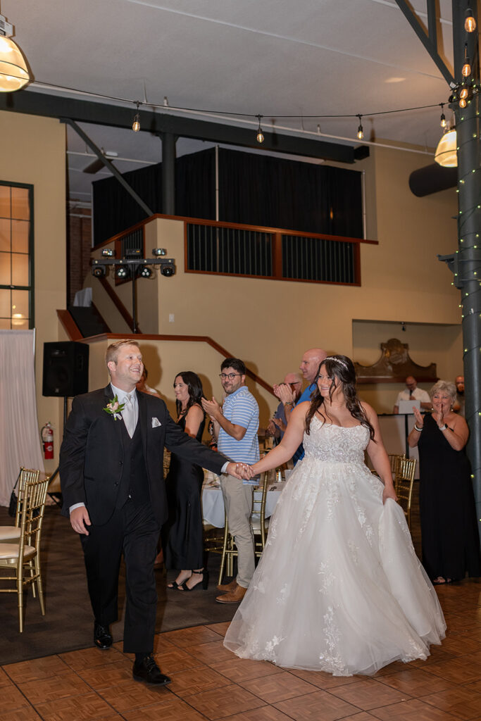 Bride and groom entering their Fort Wayne wedding reception