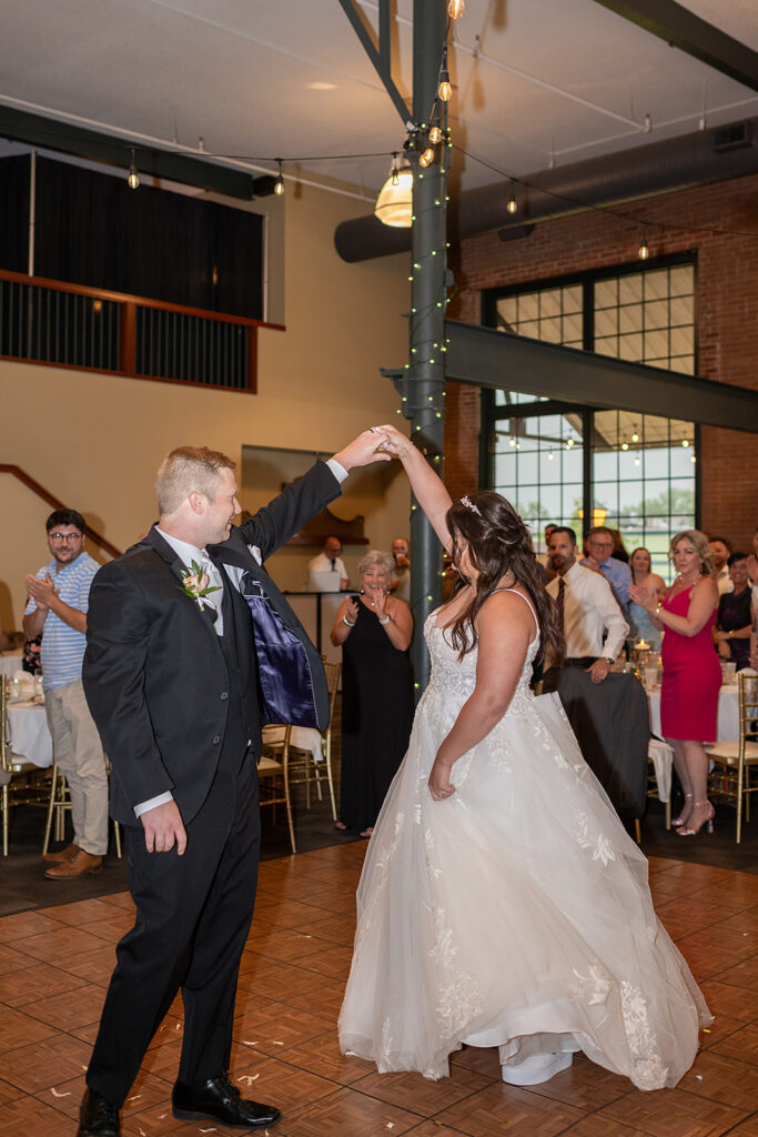 Bride and groom sharing a dance as they enter their Fort Wayne wedding reception