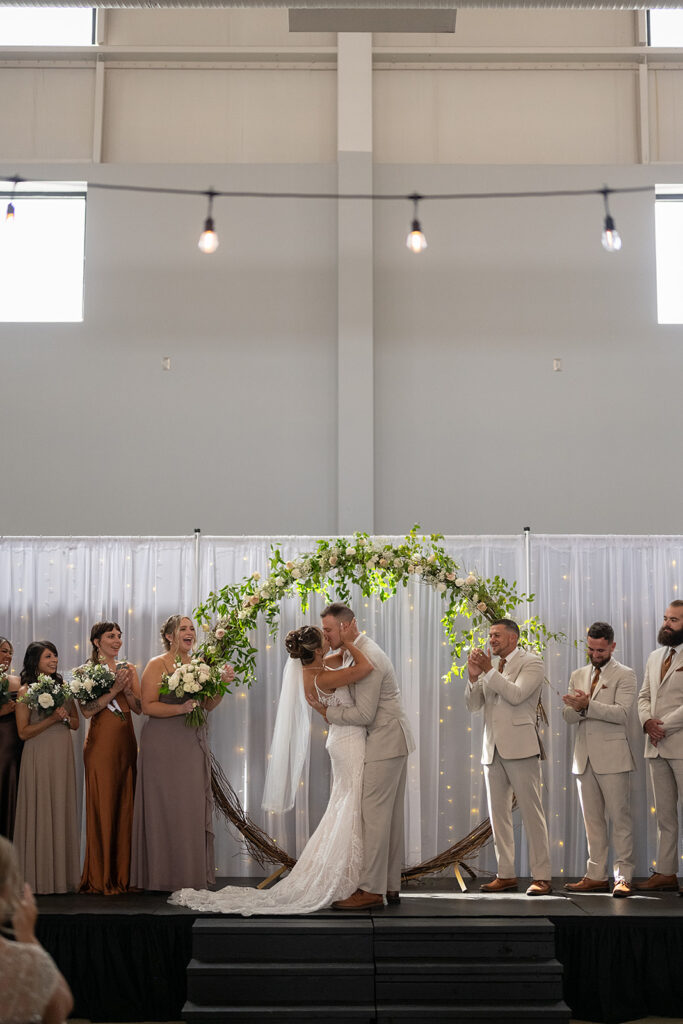 Bride and groom kissing during their Kruse Plaza wedding ceremony