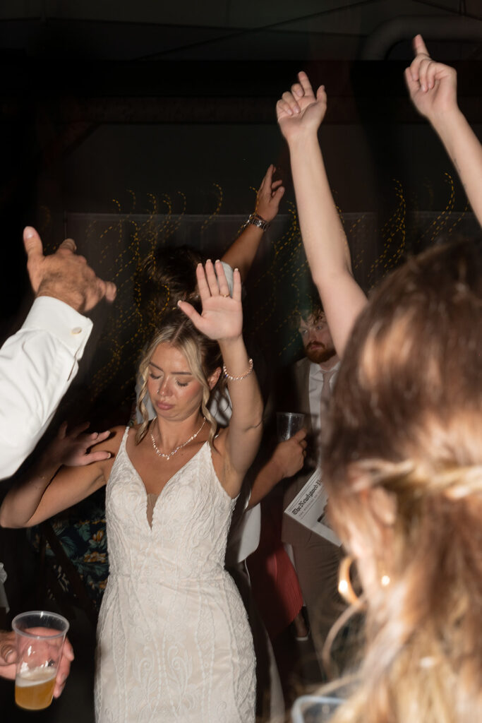 Bride dancing during her Kruse Plaza wedding reception