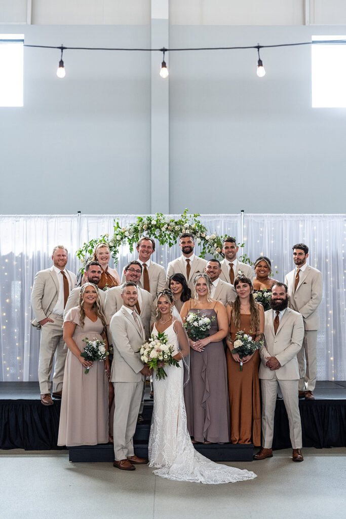 Full wedding party portraits in The Ballroom at Kruse Plaza wedding venue