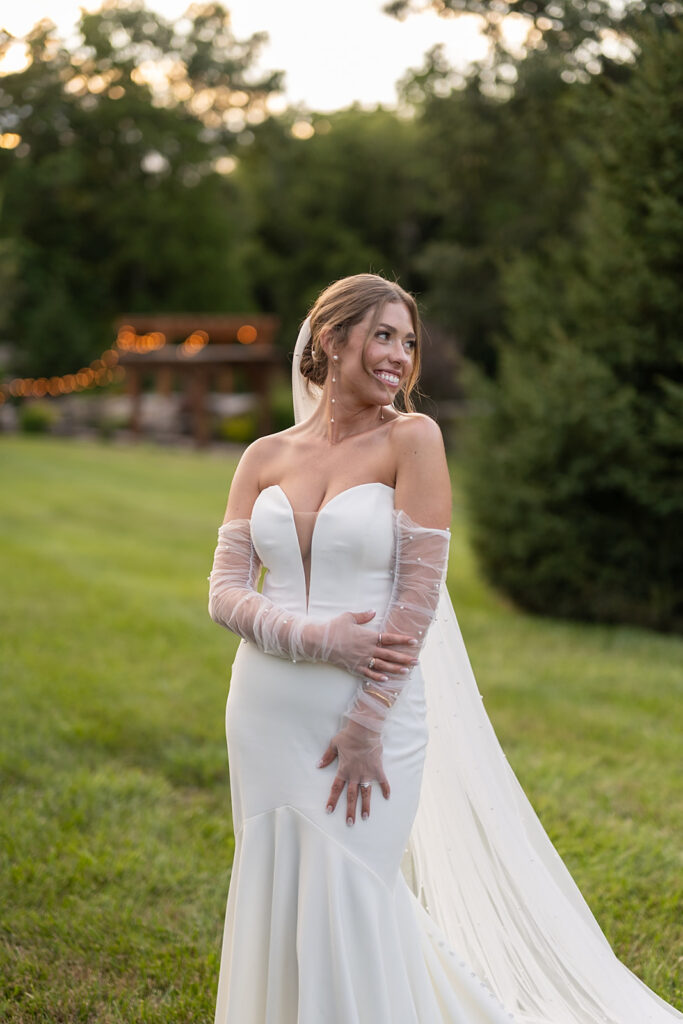 Bride posing outside of Stone Creek Lodge wedding venue in Crawfordsville, Indiana