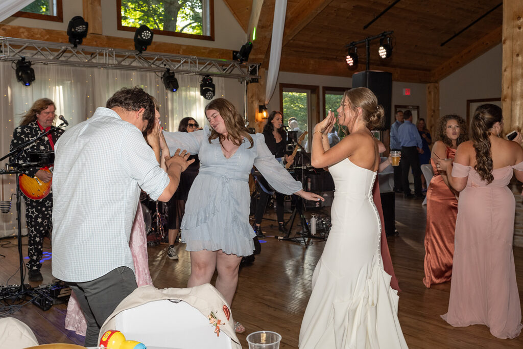 Bride dancing with guests during the reception