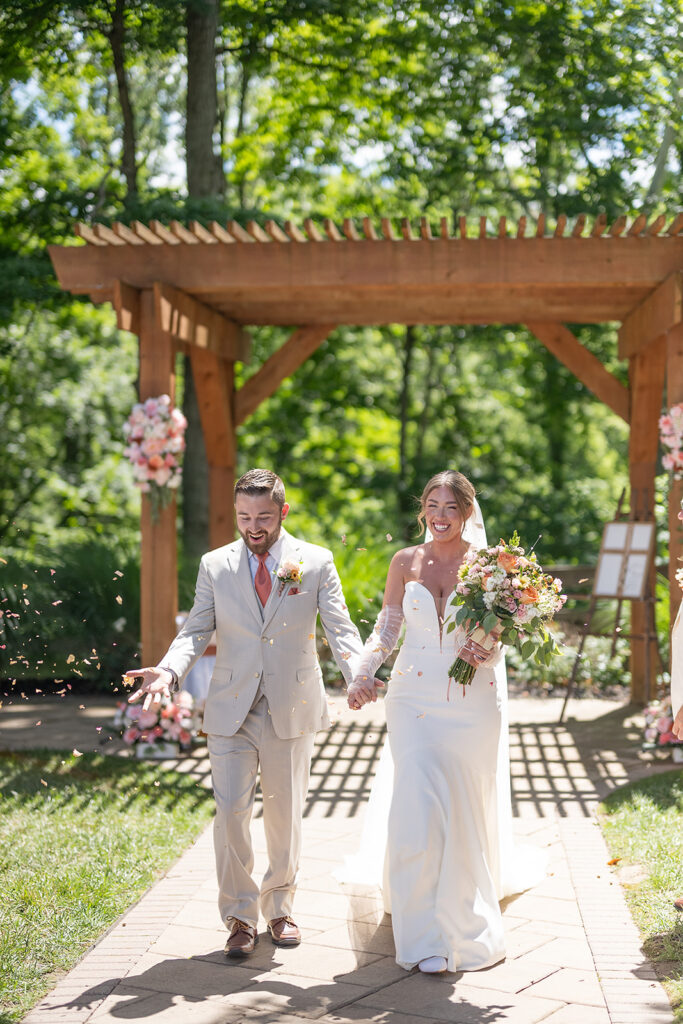 Wedding ceremony exit petal toss at Stone Creek Lodge in Indiana