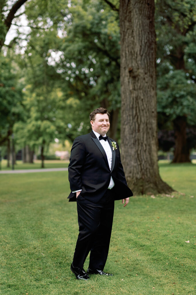 Groom turning around to see his bride