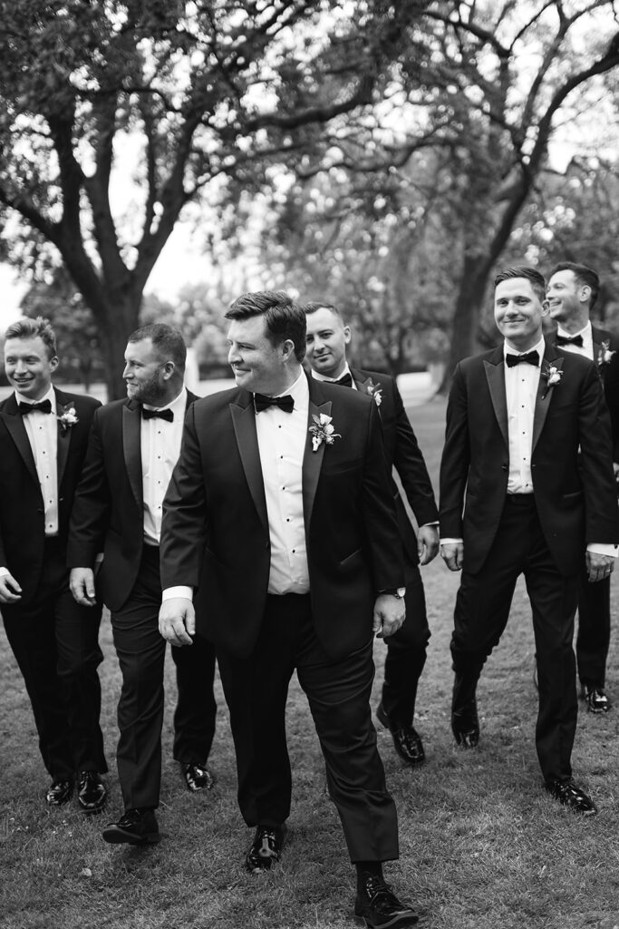 Black and white photo of a groom and his groomsmen from a River Forest Country Club wedding in Chicago