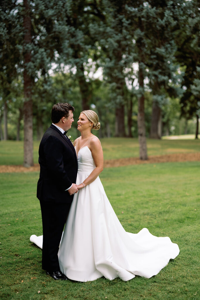 Bride and grooms outdoor wedding portraits from their River Forest Country Club wedding in Chicago