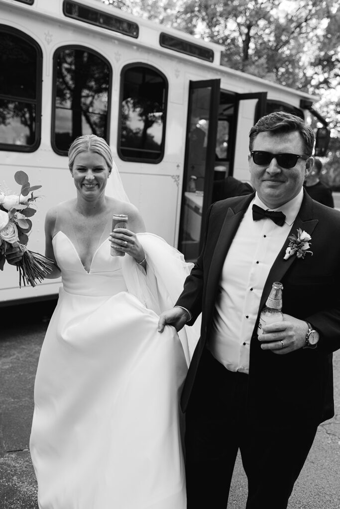 Bride and groom getting off their trolley and heading to their venue