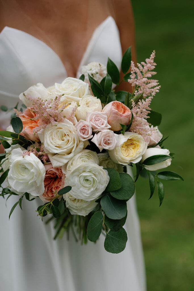 Bride holding her romantic and elegant wedding bouquet 