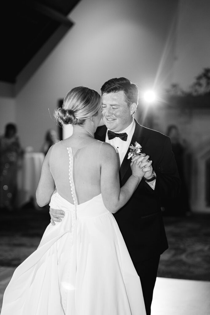 Black and white photo of a bride and grooms first dance during their River Forest Country Club wedding reception